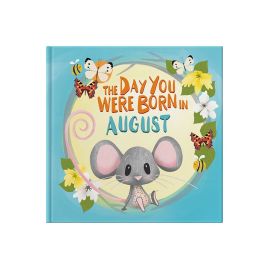 Front cover of book in a seagrass tray. Playful, illustrated mouse sat down surrounded by bees, butterflies and gladioli flowers.
