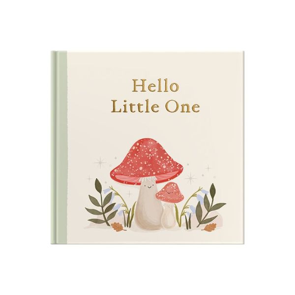 Whimsical forest illustration on the cover of a fill-in-the-blank baby keepsake book.