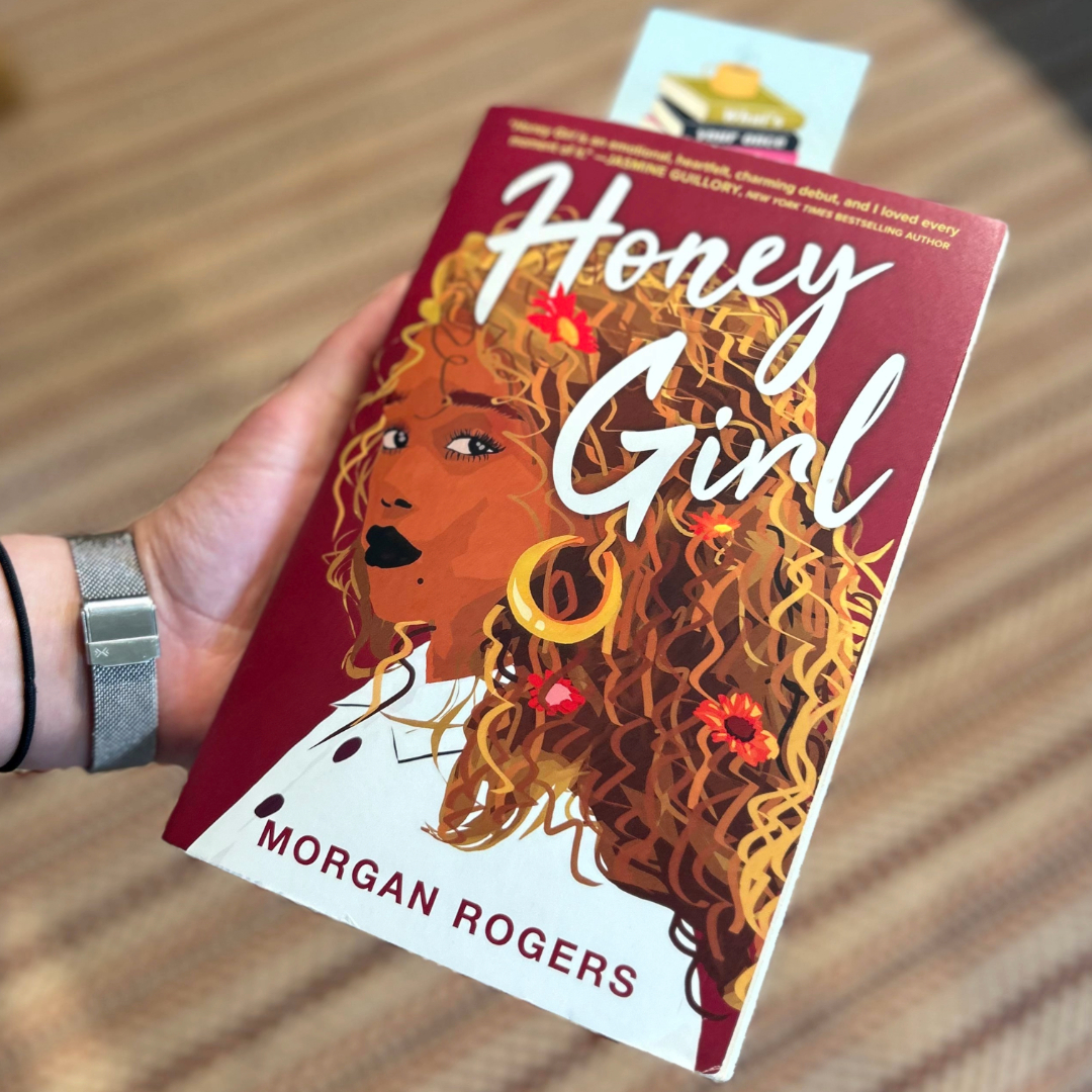 Georgia holding her top reads of 2024 - Honey Girl