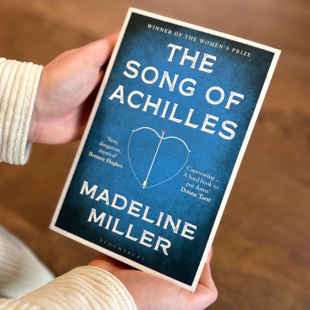 Tegan holding her top reads of 2024 - The Song Of Achilles