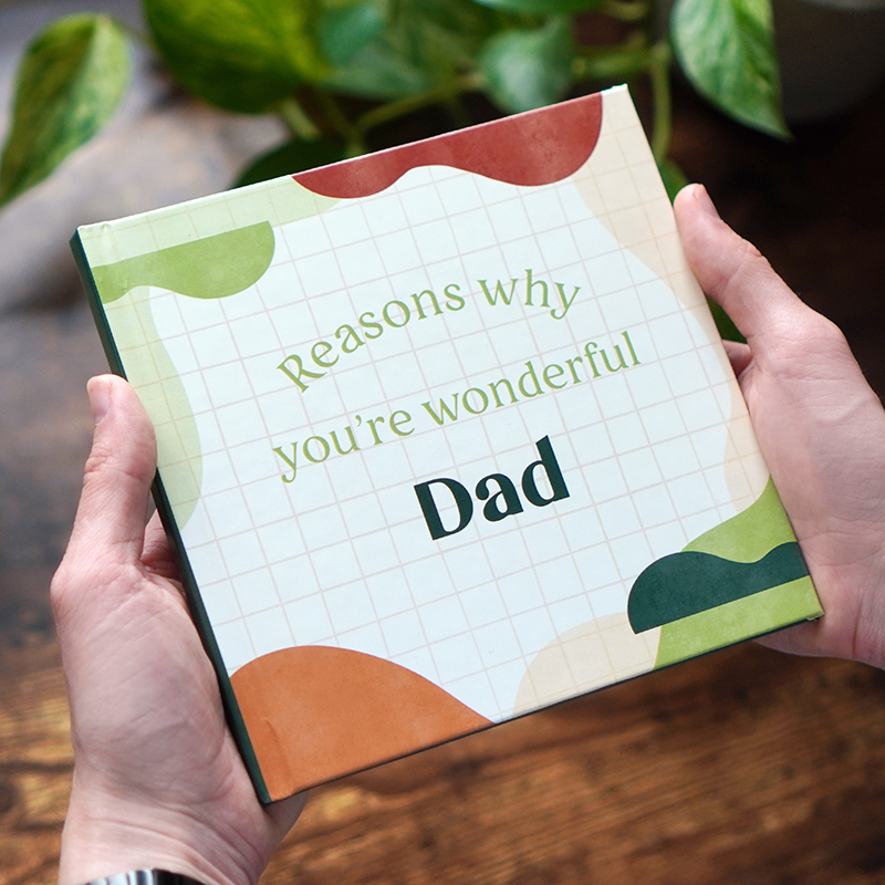 hands holding a Father's Day gift, Reasons why you're wonderful Dad book