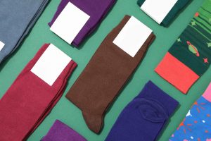 Socks laid out against green background