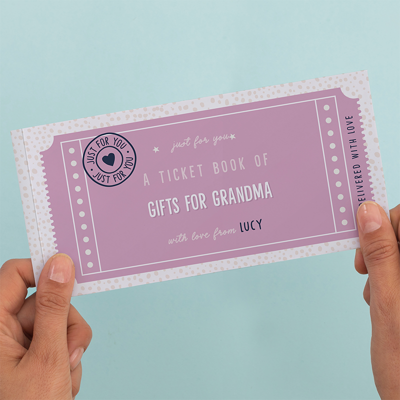 Hands holding purple ticket book, "Gifts for Grandma".