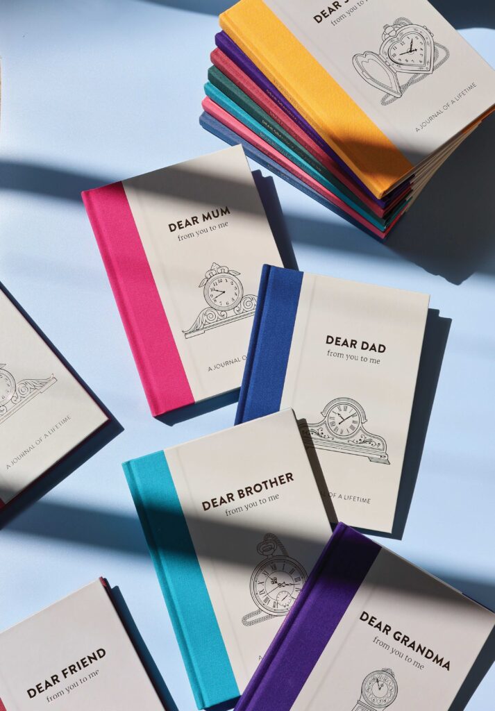A range of timeless collection memory journals with harsh shadow on them.